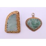 A silver gilt jade brooch and a silver gilt jade pendant. Brooch 3 cm high.