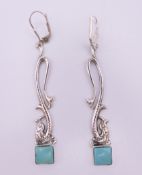 A pair of silver dress earrings. 5.75 cm high.