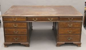 An early 20th century oak partner's desk. 182 x 123 cm.