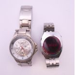Two gentlemen's wristwatches. The largest 4 cm wide.