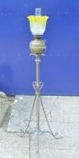 A Victorian brass standard lamp with etched yellow glass shade. 145 cm high overall.