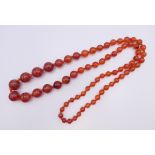 An agate bead necklace. 82 cm long.