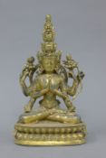 A gilt bronze model of a multi-armed deity. 28 cm high.