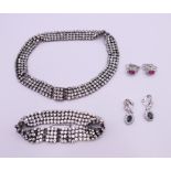 A quantity of various costume jewellery, including matching necklace and bracelet.