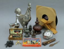 A box of miscellaneous items, including a plated cockerel and duck, a Winkle's Wedding Game,
