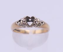 A 9 ct gold ring (lacking stones). 2.7 grammes total weight.