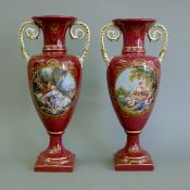 A pair of red ground porcelain vases. 41 cm high.
