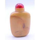 A Chinese hardstone snuff bottle and stopper. 6 cm high.
