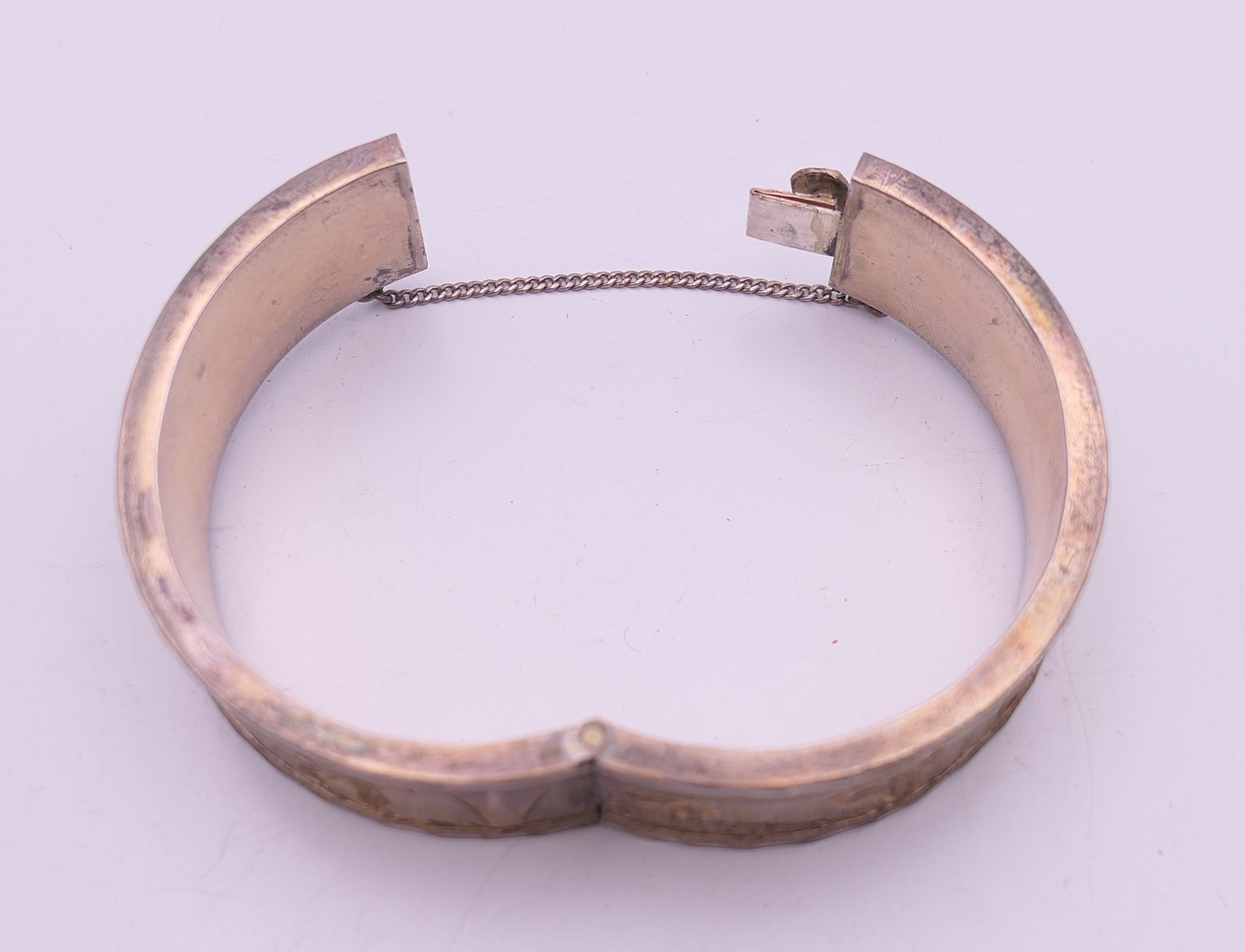 Two silver bangle formed bracelets. The largest 6.5 cm wide. 58.7 grammes. - Image 13 of 13