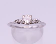 An 18 ct white gold five stone diamond ring. Centre stone spreading to approximately 0.5 carat.