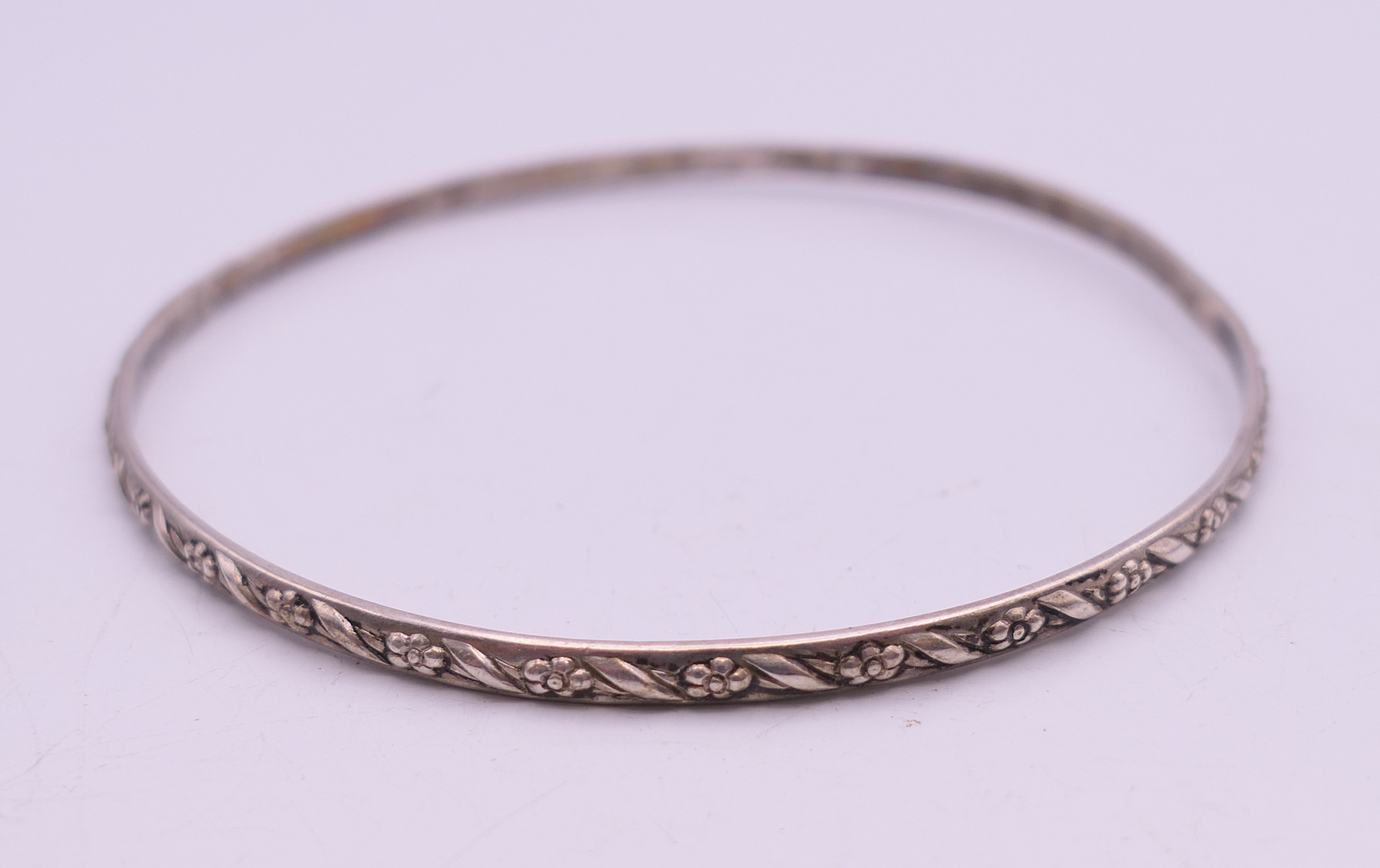 Four silver bangles. The largest 6.5 cm wide. 93.4 grammes. - Image 14 of 15