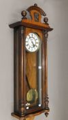 A 19th century walnut cased Vienna single weight wall clock. 123 cm high.