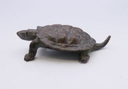 A bronze model of a tortoise. 5.5 cm long.