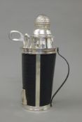 A silver plate golf caddy formed cocktail shaker. 32 cm high.
