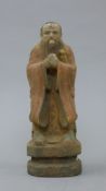 A Chinese carved wooden figure. 26 cm high.