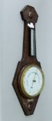 An early 20th century oak barometer. 75 cm high.