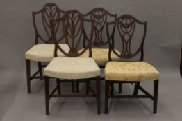 Two pairs of late 19th/early 20th century mahogany shield back dining chairs.