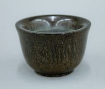 A libation cup. 9.25 cm diameter.