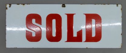 An enamel Sold sign. 49 x 18.5 cm.