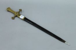 A Victorian short sword in scabbard. 64.5 cm long.
