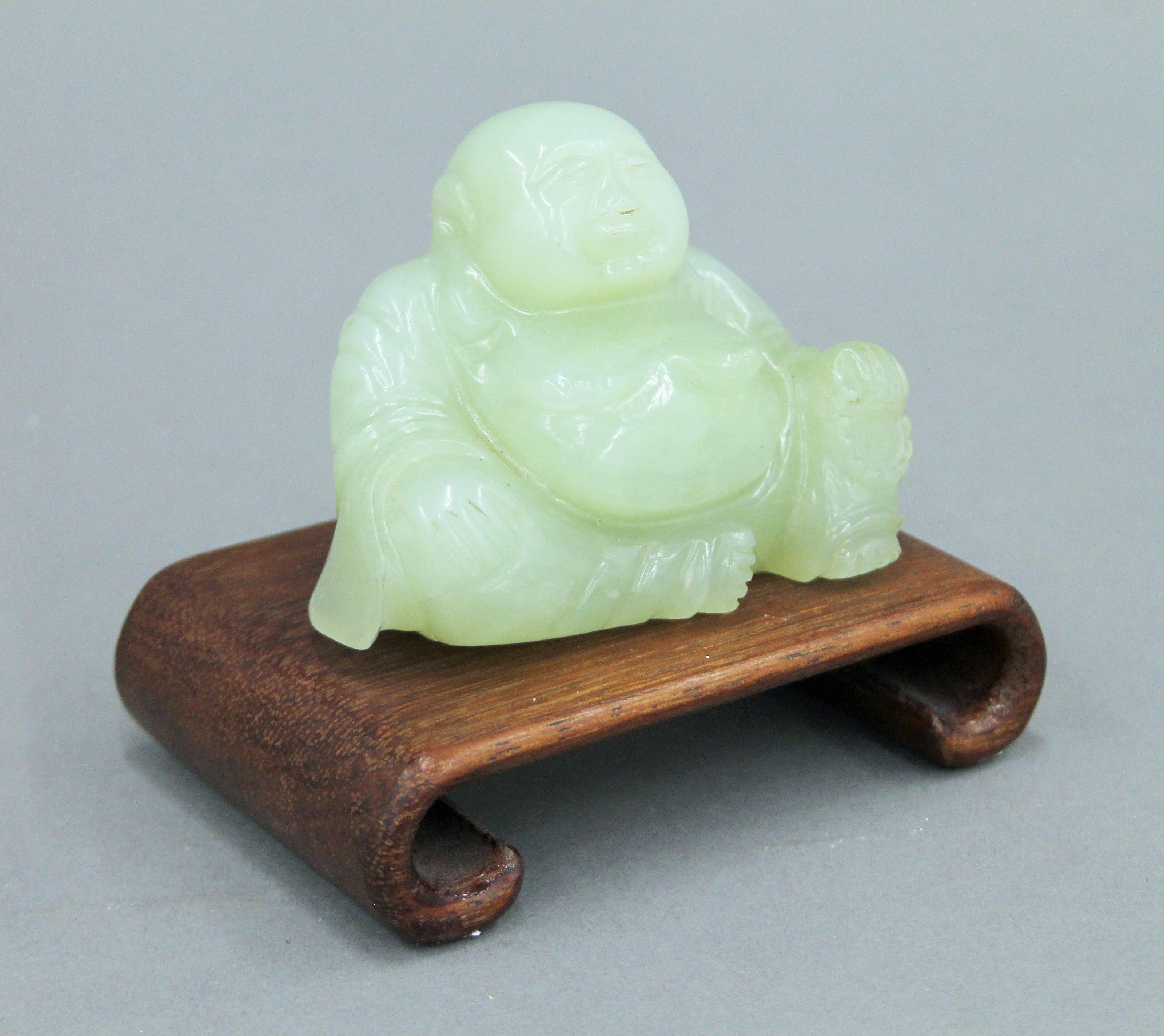 A Chinese model of Buddha on a wooden stand. 10 cm high overall. - Image 4 of 5