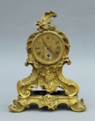 A 19th century French gilt bronze Rococo style mantle clock. 29 cm high.