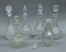 A quantity of cut glass decanters.