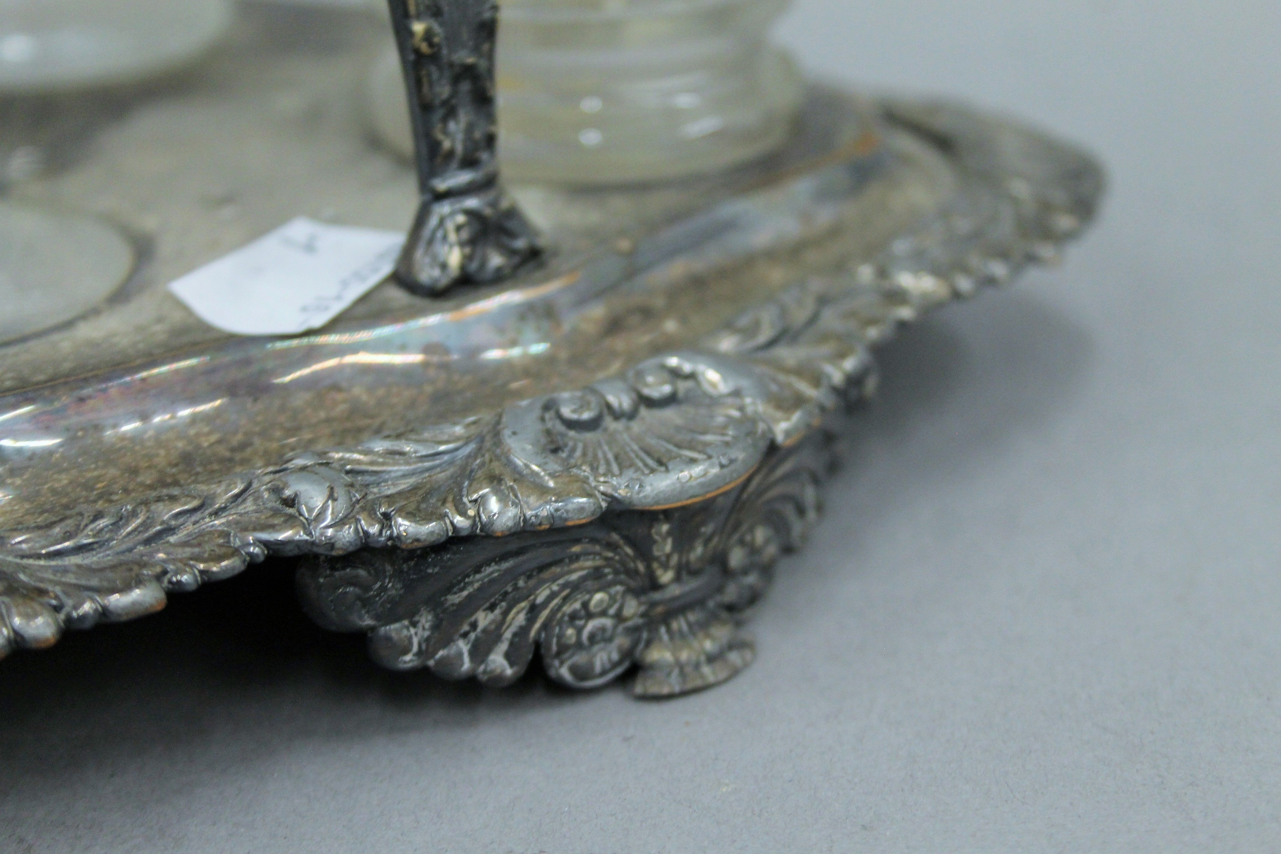 A silver plated cruet stand with associated fittings, two with silver mounts and a small silver lid. - Image 5 of 5