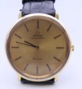 A gold plated Omega De Ville Automatic gentlemen's wristwatch. 3.75 cm wide.