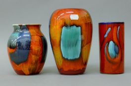 Three Poole pottery vases. The largest 20 cm high.