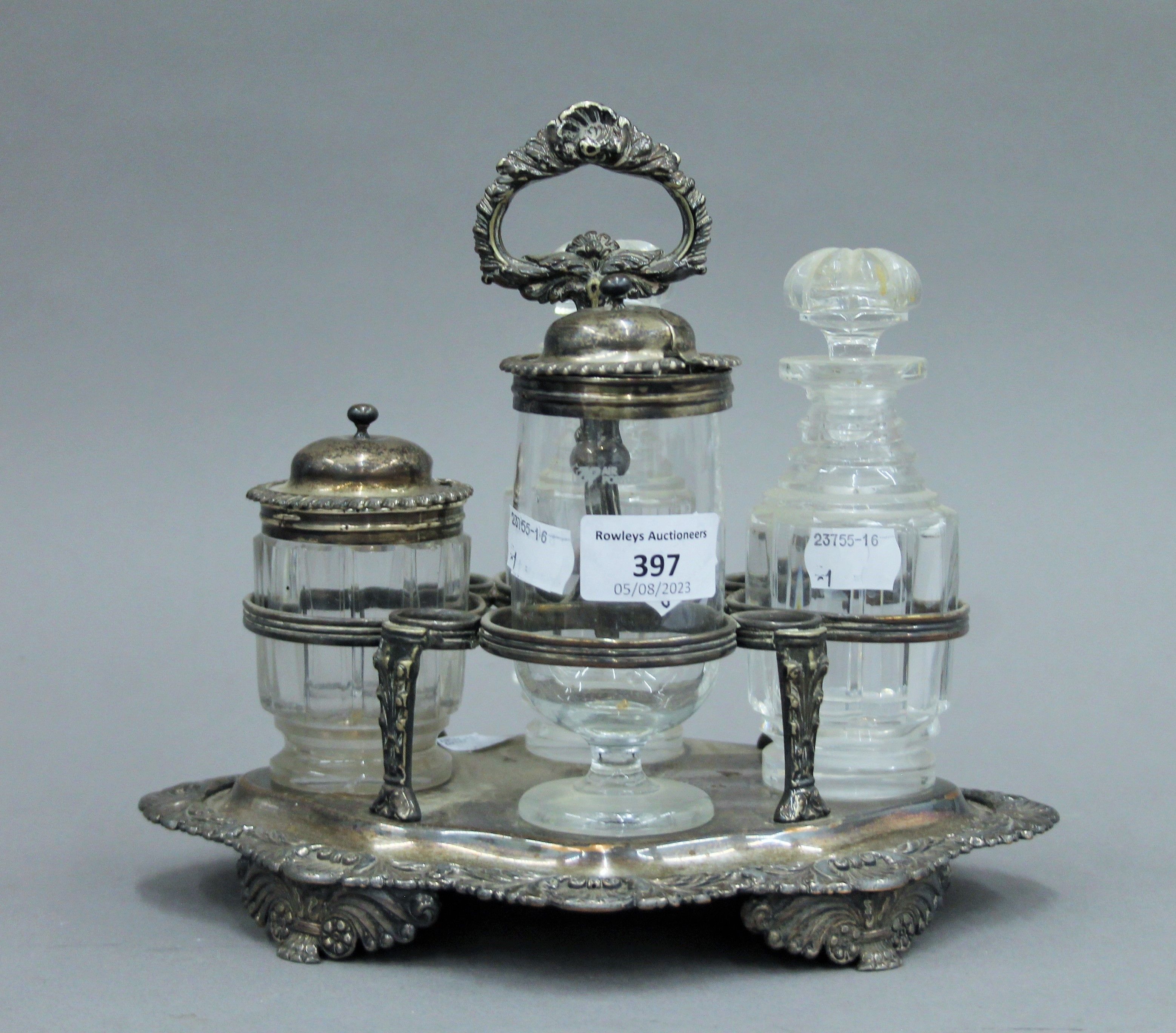 A silver plated cruet stand with associated fittings, two with silver mounts and a small silver lid. - Image 2 of 5