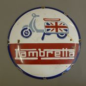 An enamel Lambretta sign. 29.5 cm diameter.