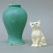 A Moorcroft vase and a Royal Doulton model of a cat. The former 16 cm high.