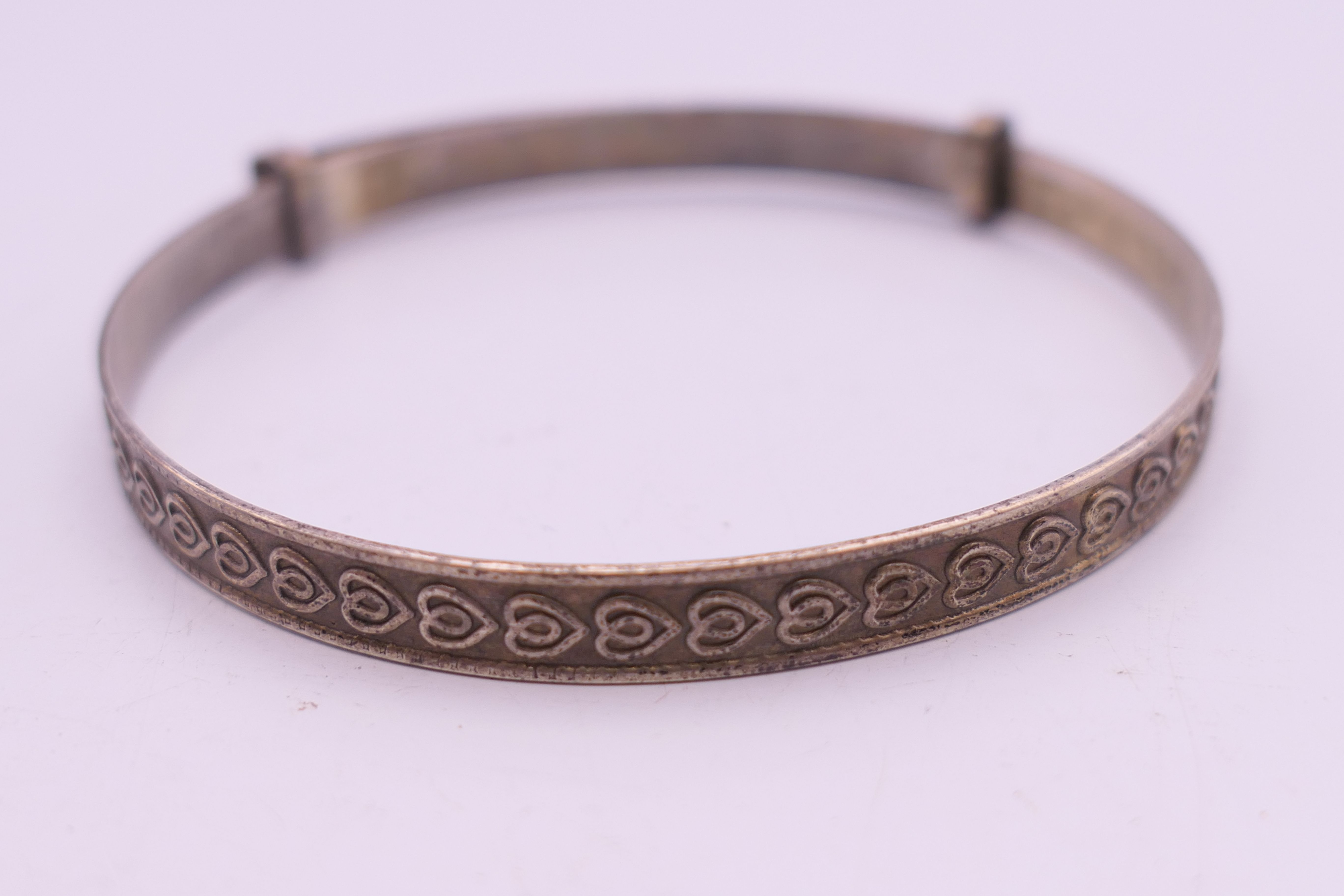 Four silver bangles. The largest 6.5 cm wide. 93.4 grammes. - Image 13 of 15