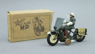 A La Moto clockwork model of a Military Police Officer on a motorbike, boxed. 12 cm long.