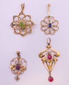 Four various gold pendants. The largest 4.5 cm long. 9.1 grammes total weight.