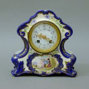 A 19th century porcelain mantle clock. 20.5 cm high.