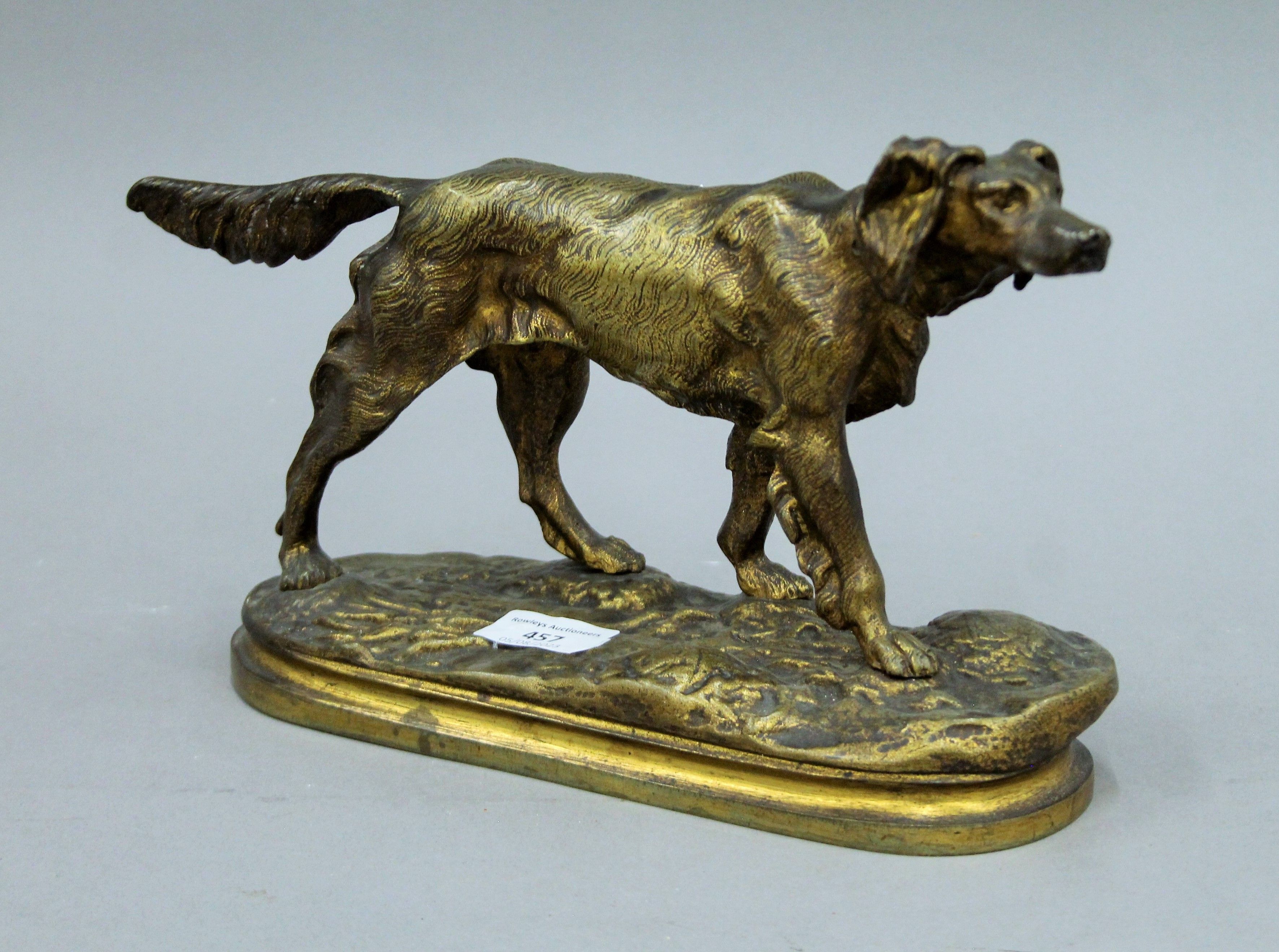 A patinated bronze model of a retriever. 32 cm long.