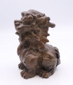 A bronze dog of fo. 5.5 cm high.