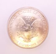 A 2002 1oz USA fine silver dollar.