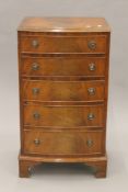 A 20th century mahogany bow front chest of drawers. 52 cm wide.