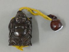 An inro formed as Buddha. 8.5 cm high.