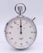 A Heuer chromed cased stopwatch in original box. 5 cm diameter.