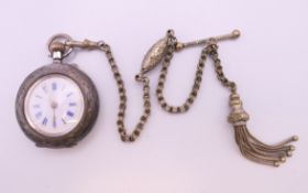 An early 20th century Continental 935 silver fob watch on a silver plated chain. 3.25 cm diameter.