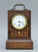 A 19th century inlaid rosewood mantle clock. 23 cm high.