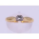 An 18 ct gold diamond solitaire ring. Ring size N. 3.1 grammes total weight.