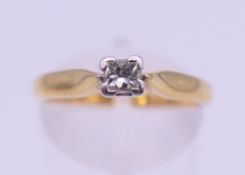 An 18 ct gold diamond solitaire ring. Ring size N. 3.1 grammes total weight.