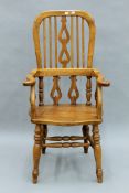 A modern oak Windsor chair. 61 cm wide.