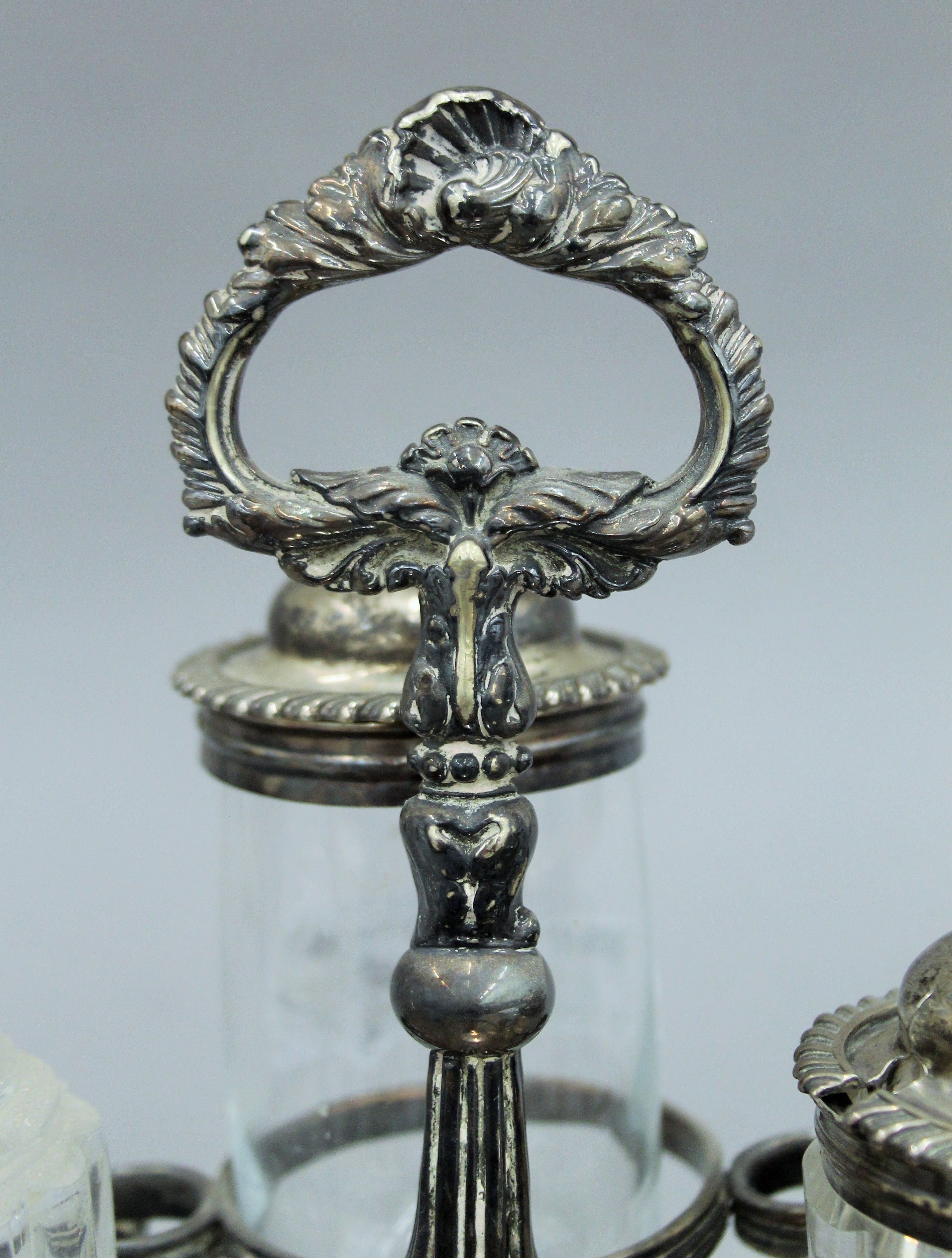 A silver plated cruet stand with associated fittings, two with silver mounts and a small silver lid. - Image 4 of 5