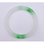 A two tone jade bangle. 5.5 cm interior diameter.